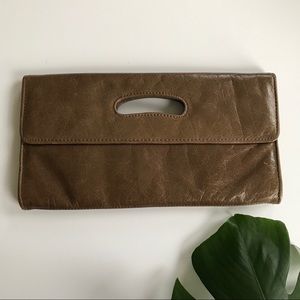 Light brown leather clutch — excellent condition!